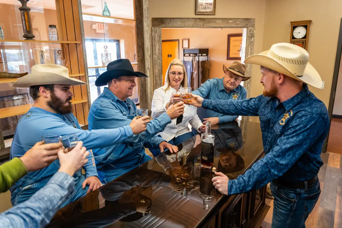 A Crowd Toast in Tasting Room.